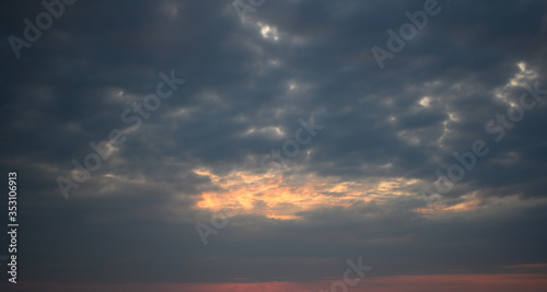 Colorful dramatic sky with stormy cloud on sunset