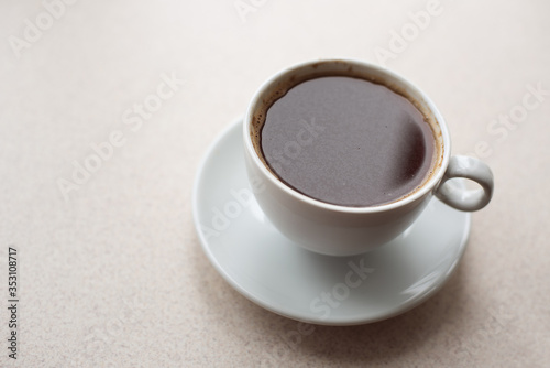 Isolated shot of a cup of black coffee on white background. Place for text