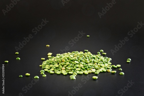 Green lentils isolated as a simple ingredient on black background