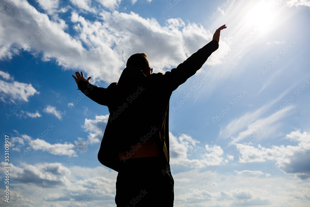 guy tourist freelancer on a background of blue sky with white clouds, bright sunny day, nature and human freedom guy tourist freelancer on a background of blue sky with white clouds, bright sunny day, nature and human freedom