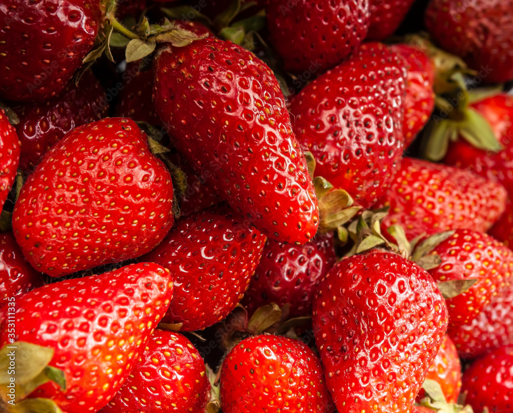 Close-up of fresh tasty strawberries. Ripe strawberry background Close-up of fresh tasty strawberries. Ripe strawberry background