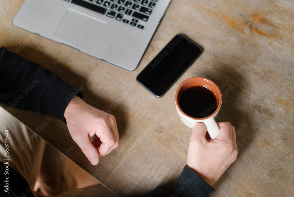 Man's hands with a cup of coffee