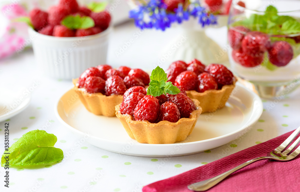 Fruit raspberry cakes on a table Fruit raspberry cakes on a table
