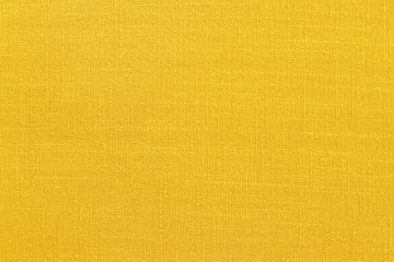 Yellow linen fabric cloth texture background, seamless pattern of natural textile.
