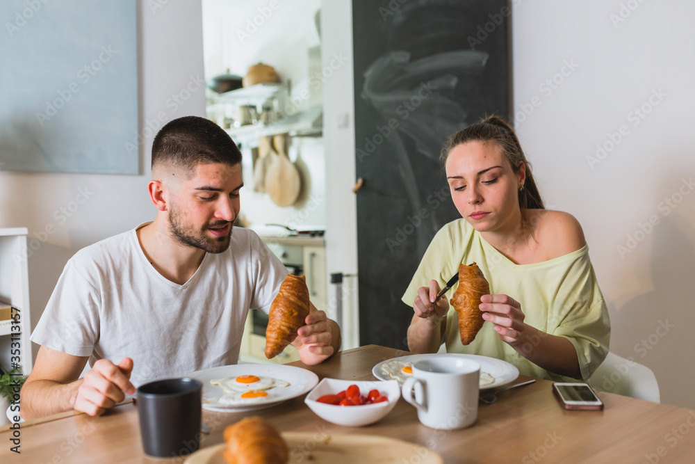 romantic man and woman couple having breakfast at home romantic man and woman couple having breakfast at home