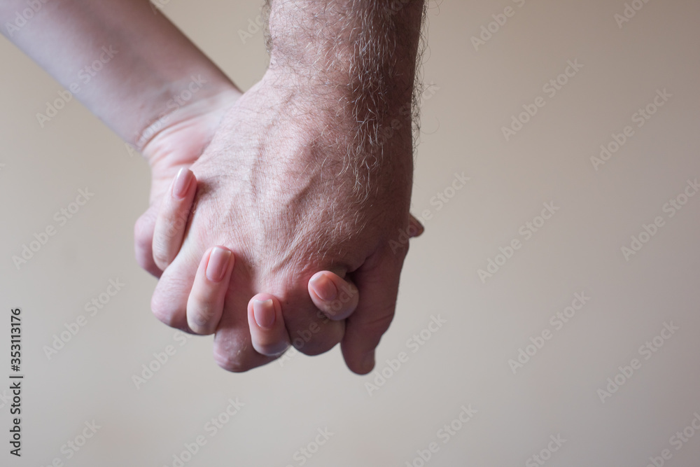 man and woman hands together