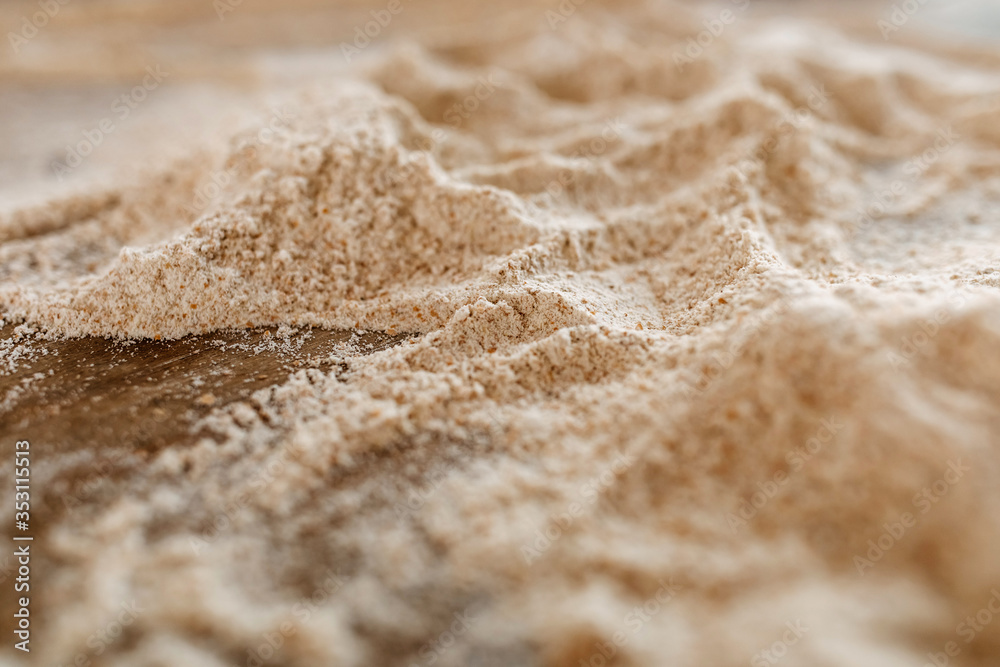 Close-up of flour on a wooden table. Close-up of flour on a wooden table.