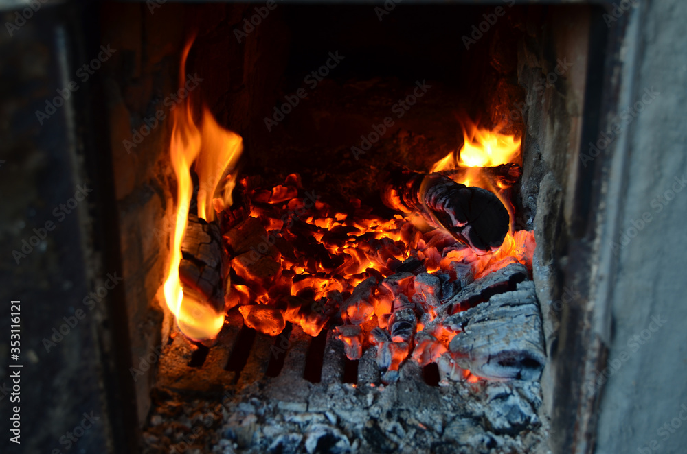 Sparks from fire in fireplace with bokeh balls. Sparks from fire in fireplace with bokeh balls.