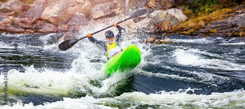 Fototapeta Naklejka Na Ścianę i Meble -  Banner whitewater kayaking, extreme sport rafting. Guy in kayak sails mountain river