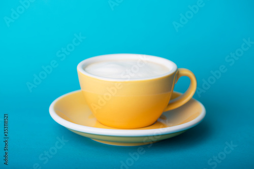 yellow cup on a blue background