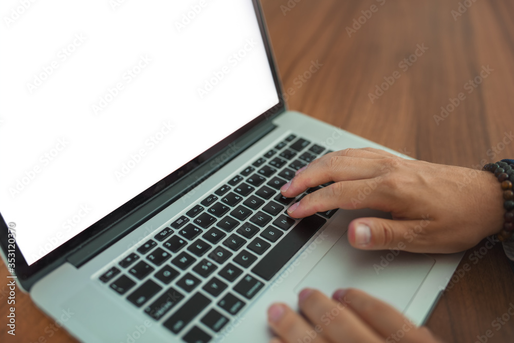 Hands working with laptop - negative space white display, shallow depth of field. Hands working with laptop - negative space white display, shallow depth of field.