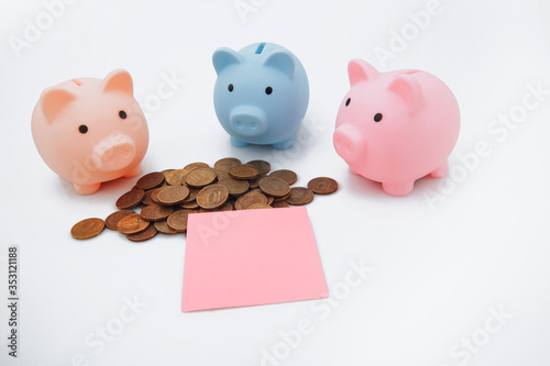 Three piggybank, money and sticky note, place for text, on white background.