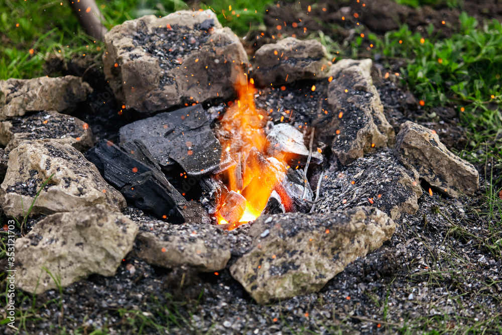 Burning coals with sparks on the nature. Burning coals with sparks on the nature.