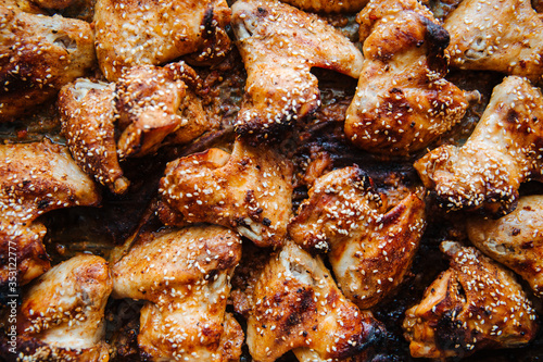 Baked pickled chicken wings. Sprinkled with sesame seeds on top.