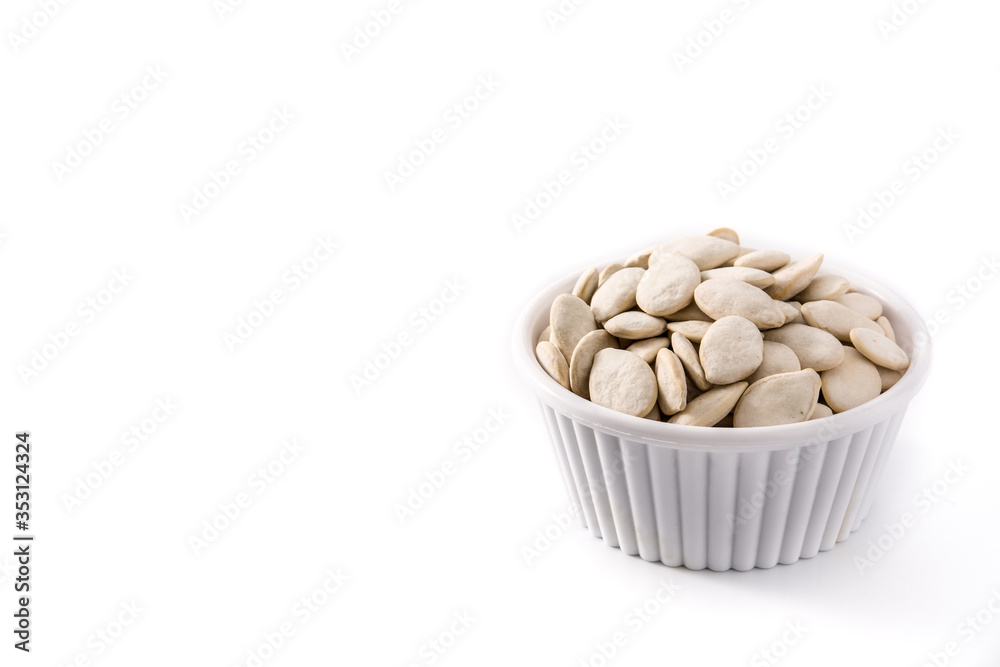 Pumpkin seeds in bowl isolated on white background. Copy space Pumpkin seeds in bowl isolated on white background. Copy space