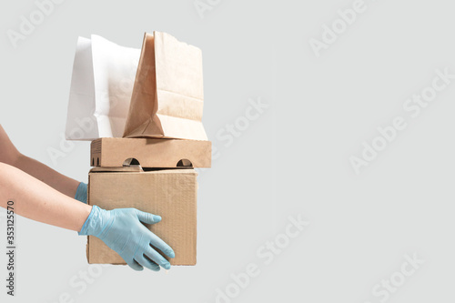 Coronavirus. Quarantine, contactless delivery during a pandemic covid. Stay at home, Online shopping. Food boxes and stamp. Contactless delivery.
