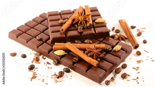 chocolate with spices on white background