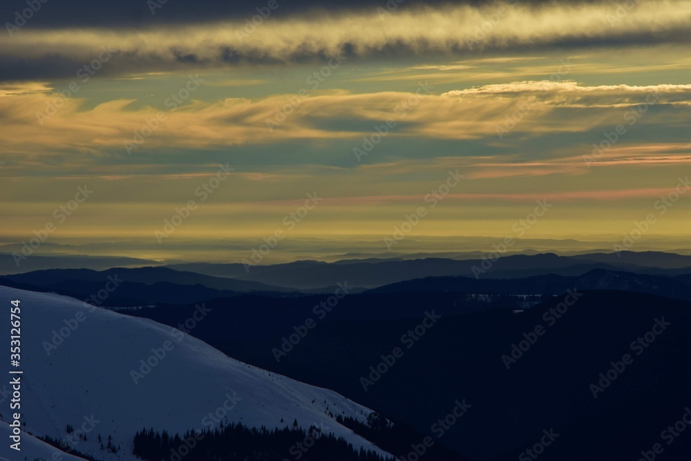 colorfully clouds at sunset in top of the mountain on winter time at high altitudes