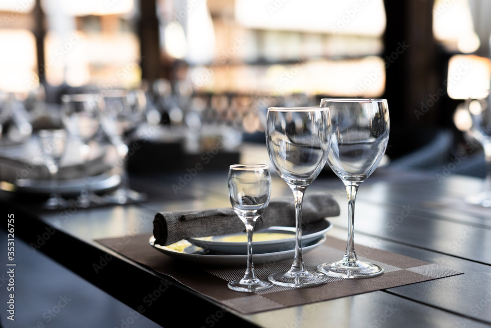 Festive table setting with empty wine glasses Festive table setting with empty wine glasses