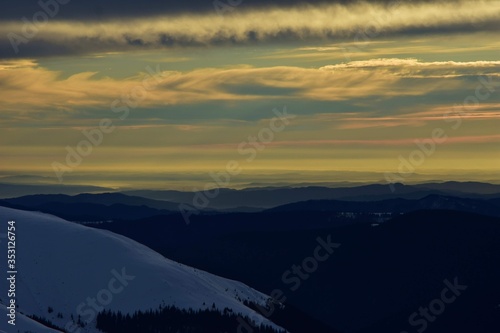 colorfully clouds at sunset in top of the mountain on winter time at high altitudes