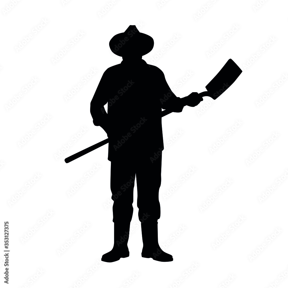 Silhouette of farmer posing with a shovel