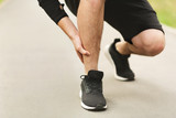 Calf sport muscle injury. Runner with muscle pain in leg