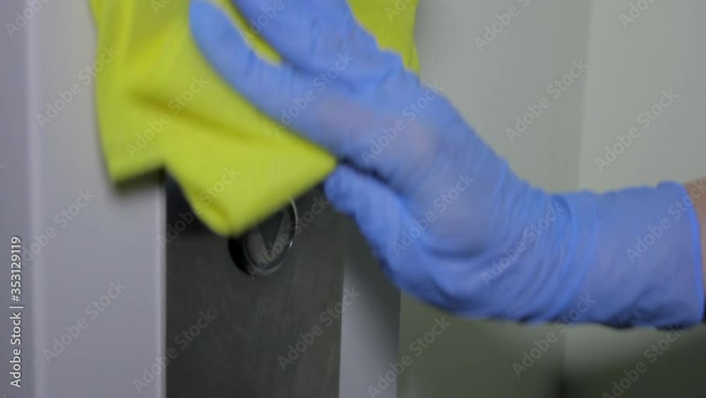 Hand in latex glove applies disinfectant alcohol antiviral spray on ...