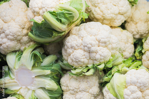 Banner of fresh cauliflower on the counter in a supermarket, market, greengrocery.