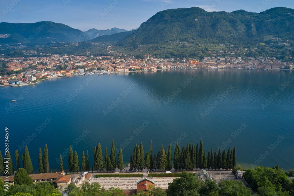 City cemetery of Salò, in the background the city of Salò, mountains, Lake Garda, Italy. Aerial view