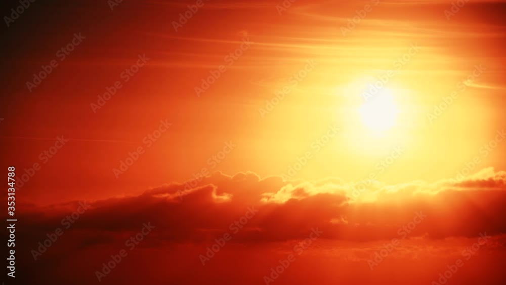 Red burning sun with dark clouds at sunrise. Morning skyscape Red burning sun with dark clouds at sunrise. Morning skyscape
