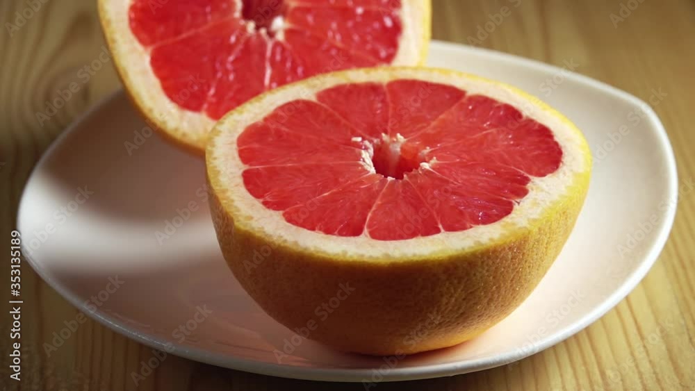 Water Shower on a Slice of Grapefruit. Slow Motion Water Shower on a Slice of Grapefruit. Slow Motion
