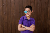Portrait of boy in glasses with patch. Eye patch for glasses t treat lazy eye, amblyopia, strabismus.	
