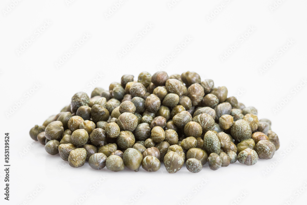 Capers isolated on a white background. Bunch canned pickled or salted capers. Capers isolated on a white background. Bunch canned pickled or salted capers.