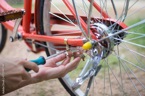 Checking bicycle brake, person is fixing the bicycle brake, Close-up