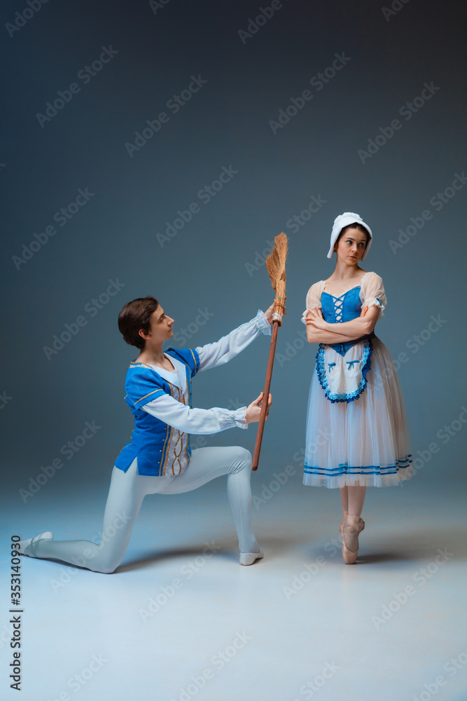 Naklejka premium Young and graceful ballet dancers as Cindrella fairytail characters on studio background. Art, motion, action, flexibility, inspiration concept. Flexible caucasian ballet dancers posing, dancing.