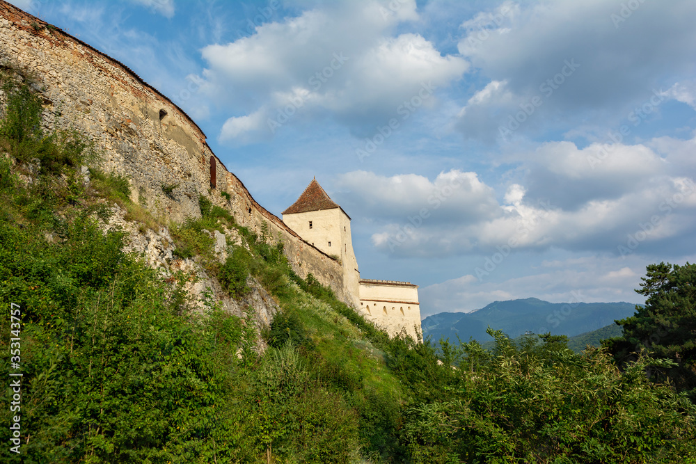 Râșnov Citadel with Carpatian Mountains on the background. Rasnov Town, Romania Râșnov Citadel with Carpatian Mountains on the background. Rasnov Town, Romania