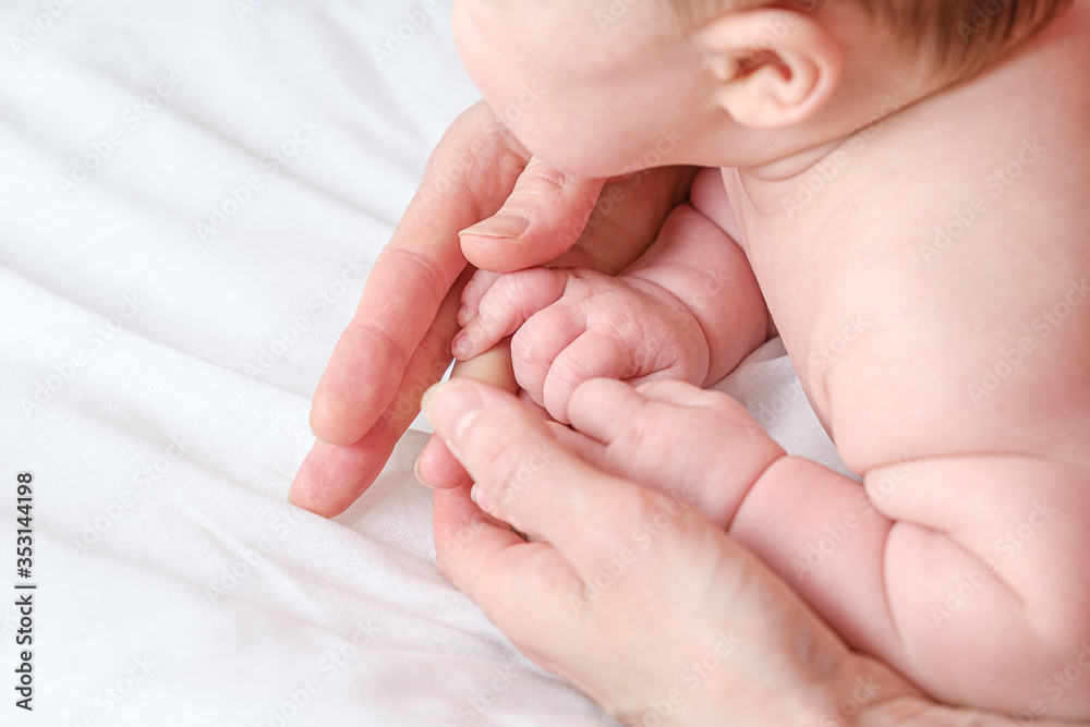 baby foot in mom's hands. massage concept for babies. The feet of a tiny newborn baby on a female hand shape close up. Mom and her child. baby foot in mom's hands. massage concept for babies. The feet of a tiny newborn baby on a female hand shape close up. Mom and her child.