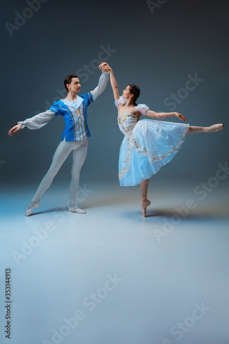 Принти на полотні Young and graceful ballet dancers as Cindrella fairytail characters on studio background