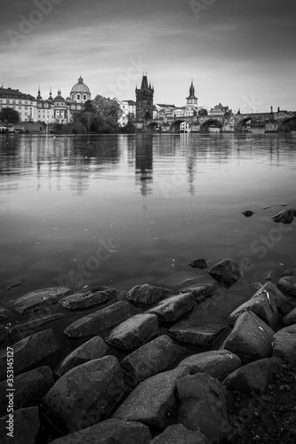 Obraz na płótnie Prague skyline and bridge over river in black and white. Czech Republic. w salonie