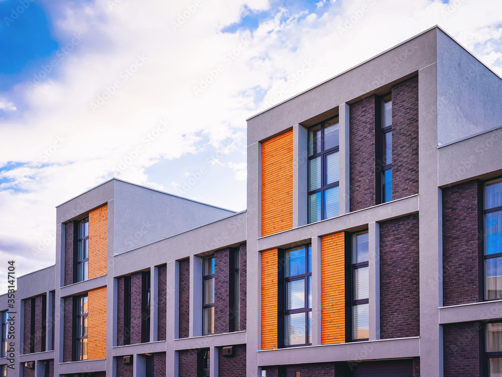 Fragment of modern apartment house copy space blue sky clouds_4x3 Fragment of modern apartment house copy space blue sky clouds_4x3