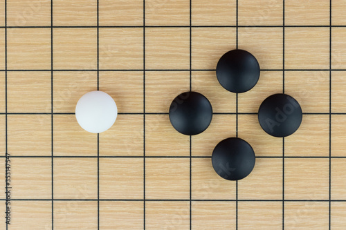 Simple training position of black and white stones on the playing field (gohan) of Chinese game go