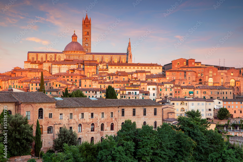 Siena. Aerial cityscape image of medieval city of Siena, Italy during sunset.	