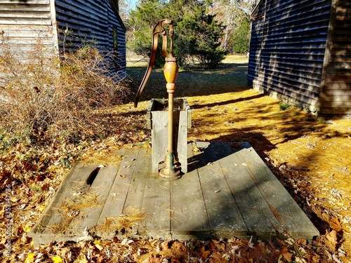 A historic water pump at Batsto Village, New Jersey in autumn photo