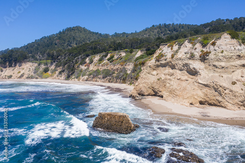 The Pacific Ocean washes against the beautiful and rugged coastline not far from Santa Cruz, California. This area, south of San Francisco, is known for its great surfing and gorgeous beaches.