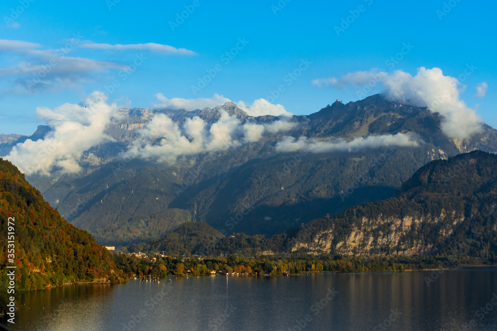 Aerial view of cloudy mountains with Brienz lake water down below