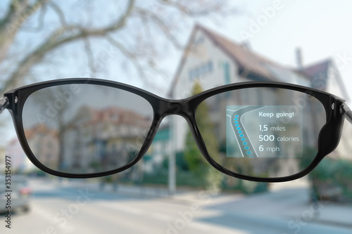 Fototapeta Naklejka Na Ścianę i Meble -  Morning run with smart glasses showing route and other information