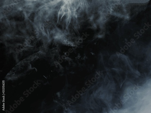 white smoke on dark background