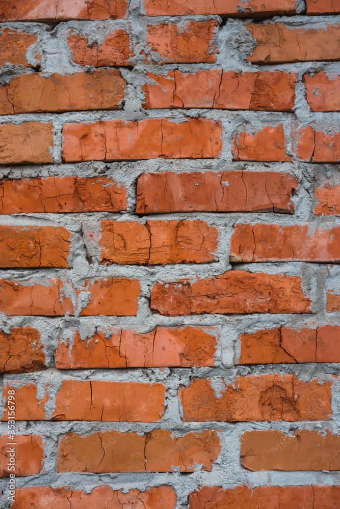 An old orange brick wall. The brick background. An old orange brick wall. The brick background.