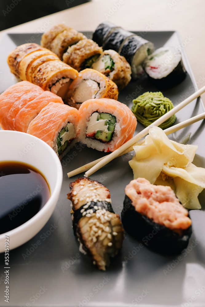 Freshly cooked sushi chef, delicious big rolls with avocado, cheese, salmon, sesame seeds Freshly cooked sushi chef, delicious big rolls with avocado, cheese, salmon, sesame seeds