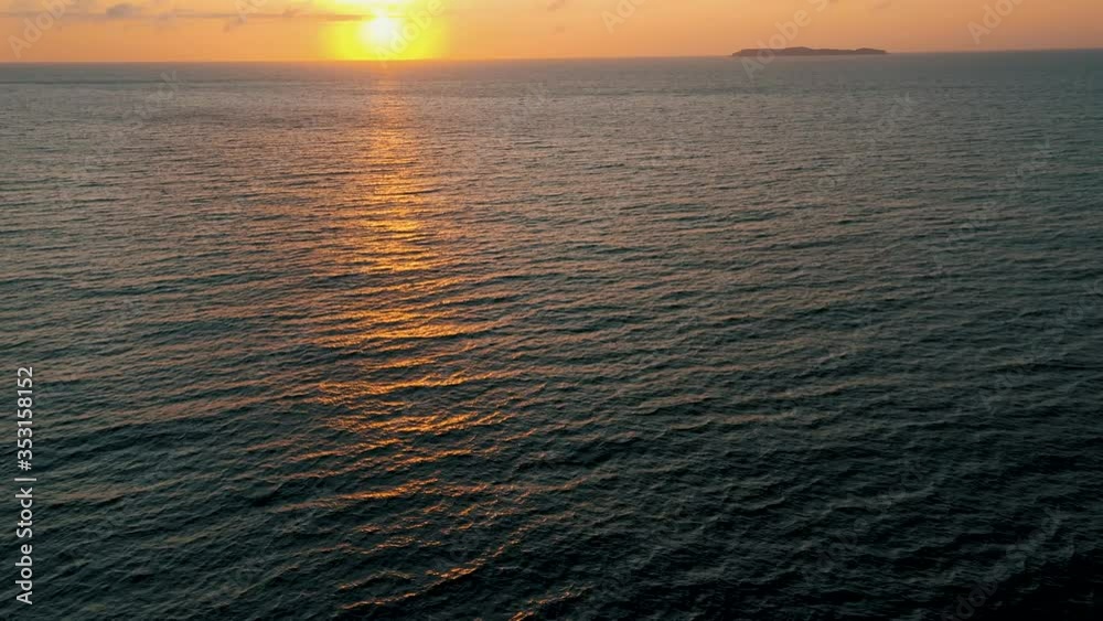 Aerial view revealing the sunrise over the ocean, South America, Santa Catarina, Brazil Aerial view revealing the sunrise over the ocean, South America, Santa Catarina, Brazil